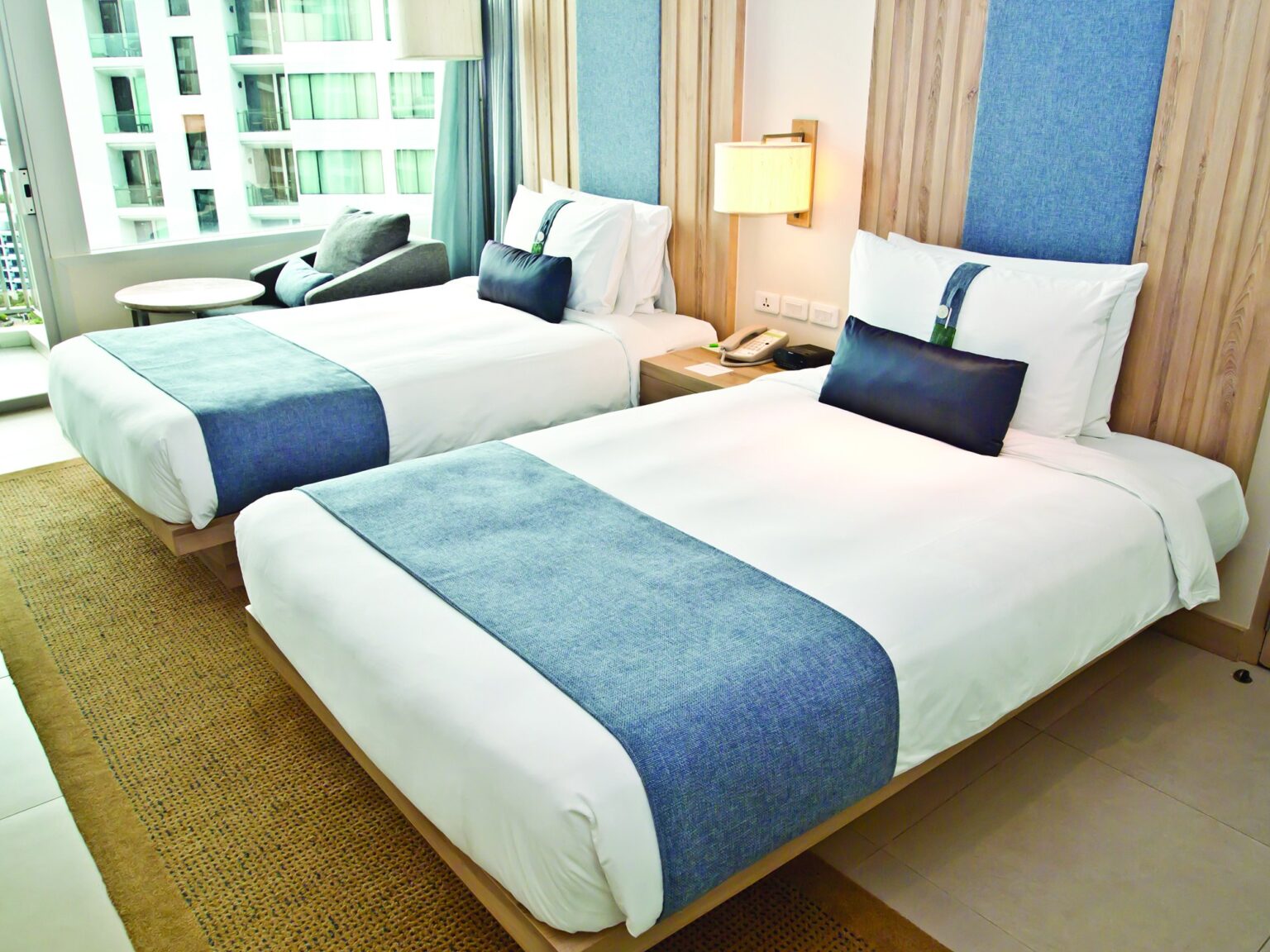 Hotel Bed Sheet White Percale T200 CottonPoly Thomaston on bed